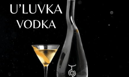 vodka bottle with full fill glass on black background