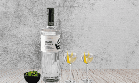 haku vodka bottle with two cocktail glass on top