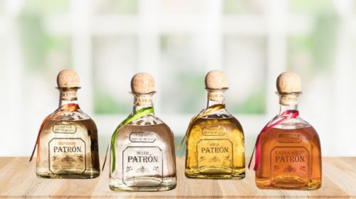 PATRON TEQUILA FOUR TYPES BOTTLE ON TABLE 